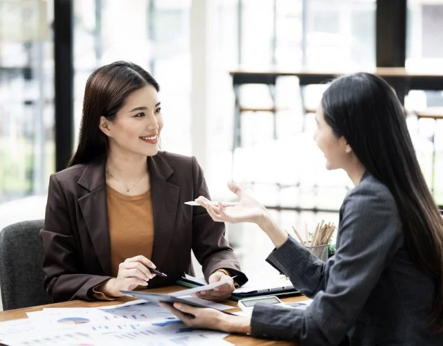 Real estate agent communicating with clients